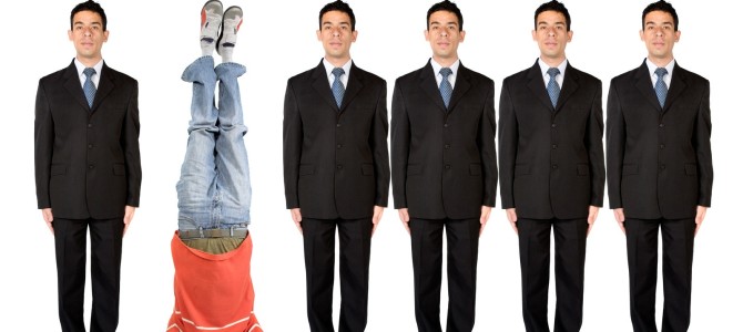 Men standing in a row, 1 upside down
