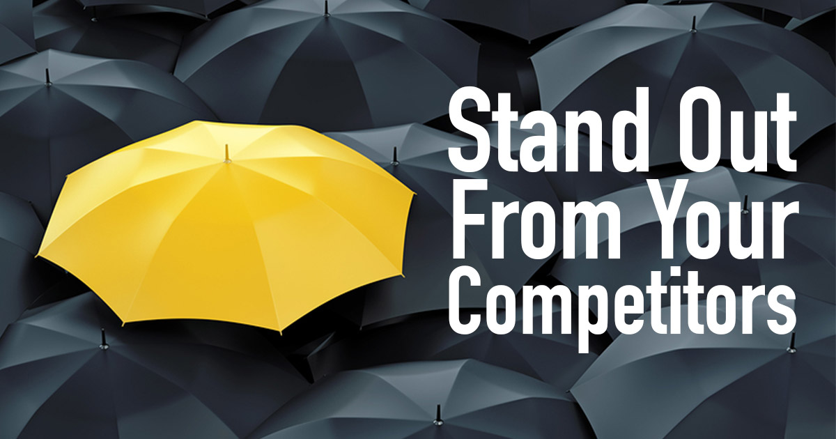 1 yellow umbrella amongst all black umbrellas