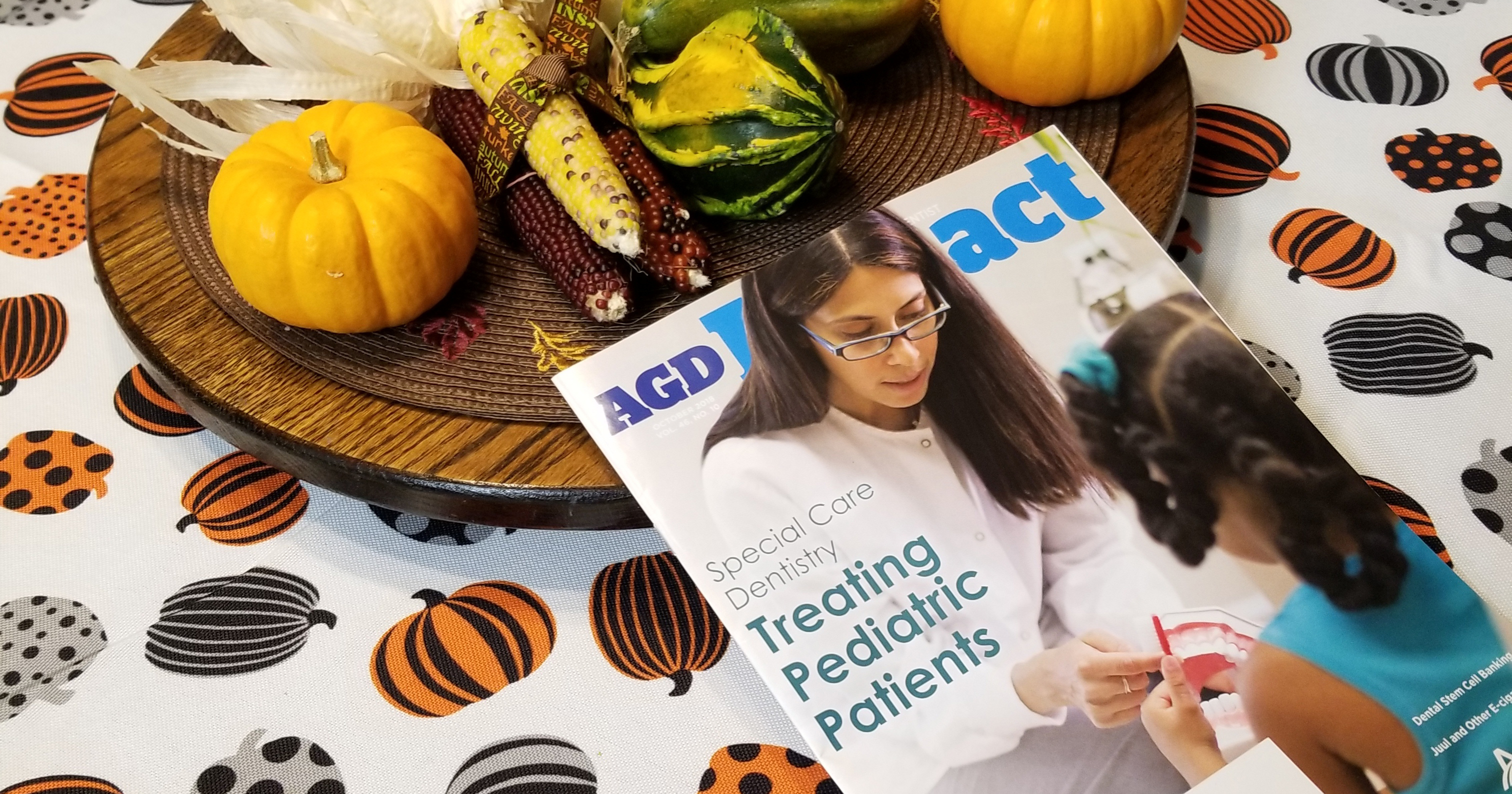 AGD magazine on a fall decor table